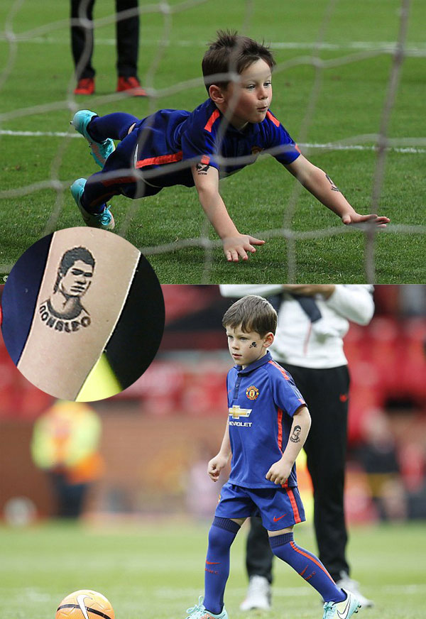 Con trai Rooney ve hinh xam Ronaldo va Messi tren canh tay