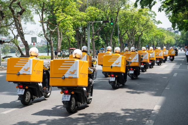 Honda Viet Nam va Buu dien Viet Nam day manh hop tac mo rong du an su dung xe dien giao hang - 12